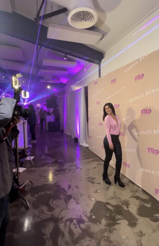Fake it till you make it mindset — Jasmine Del Toro of Layers of Beauty posing confidently at a beauty influencer event step and repeat while building a dream career