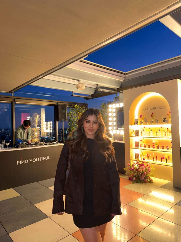 Jasmine Del Toro at the Jung Saem Mool JSM Beauty US launch event in West Hollywood, standing in front of the Find Youtiful display and illuminated product shelf