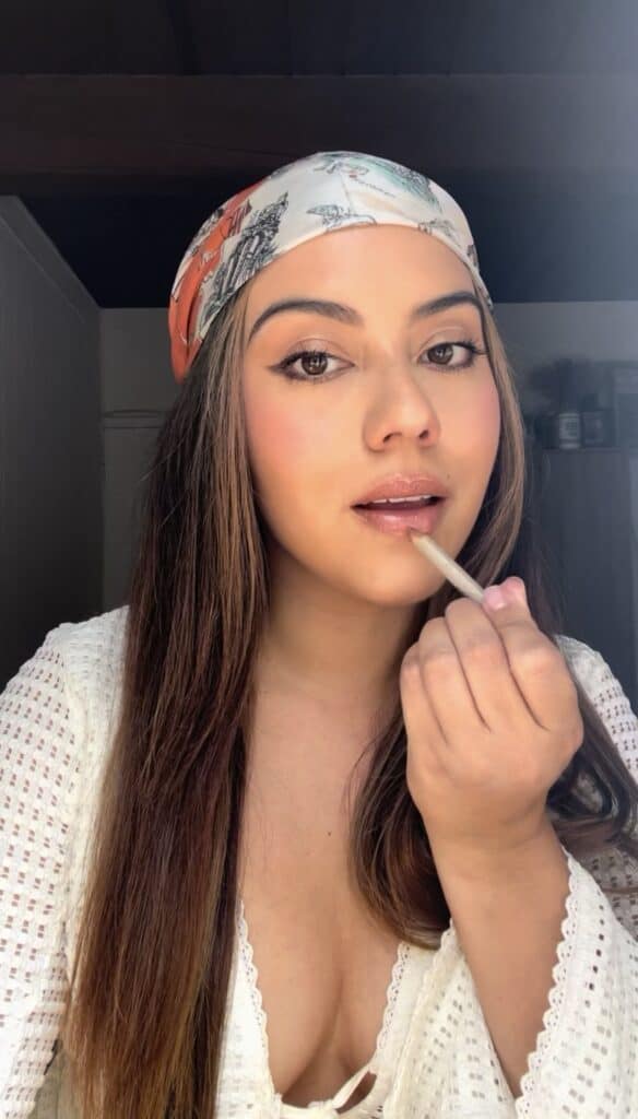 Founder of Layers of beauty applying a nude lip liner pencil for a defined, natural lip look