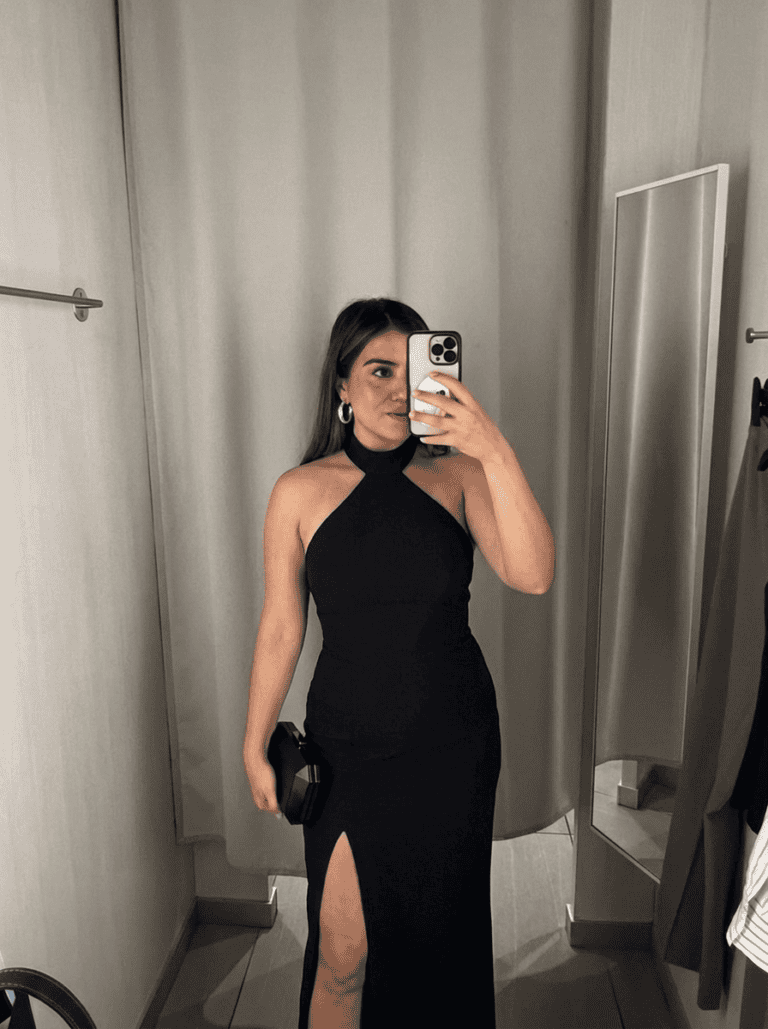 layers of beauty founder wearing black tie outfit