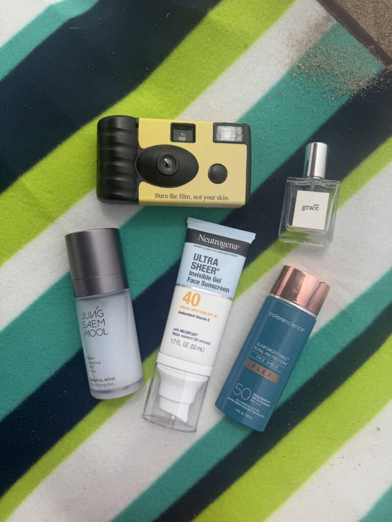 layers of beauty founder showing beach day essentials
