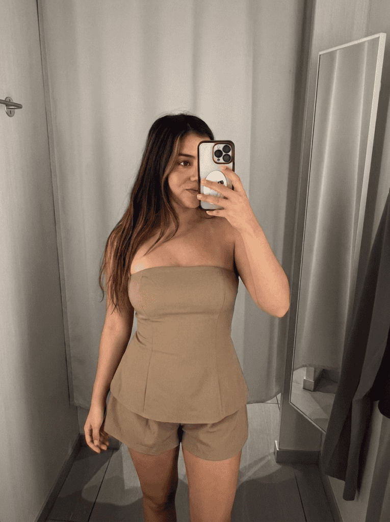 jasmine , layers of beauty founder, wearing a revolve summer romper