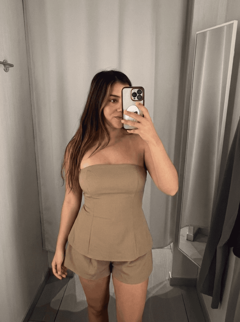 jasmine , layers of beauty founder, wearing a revolve summer romper