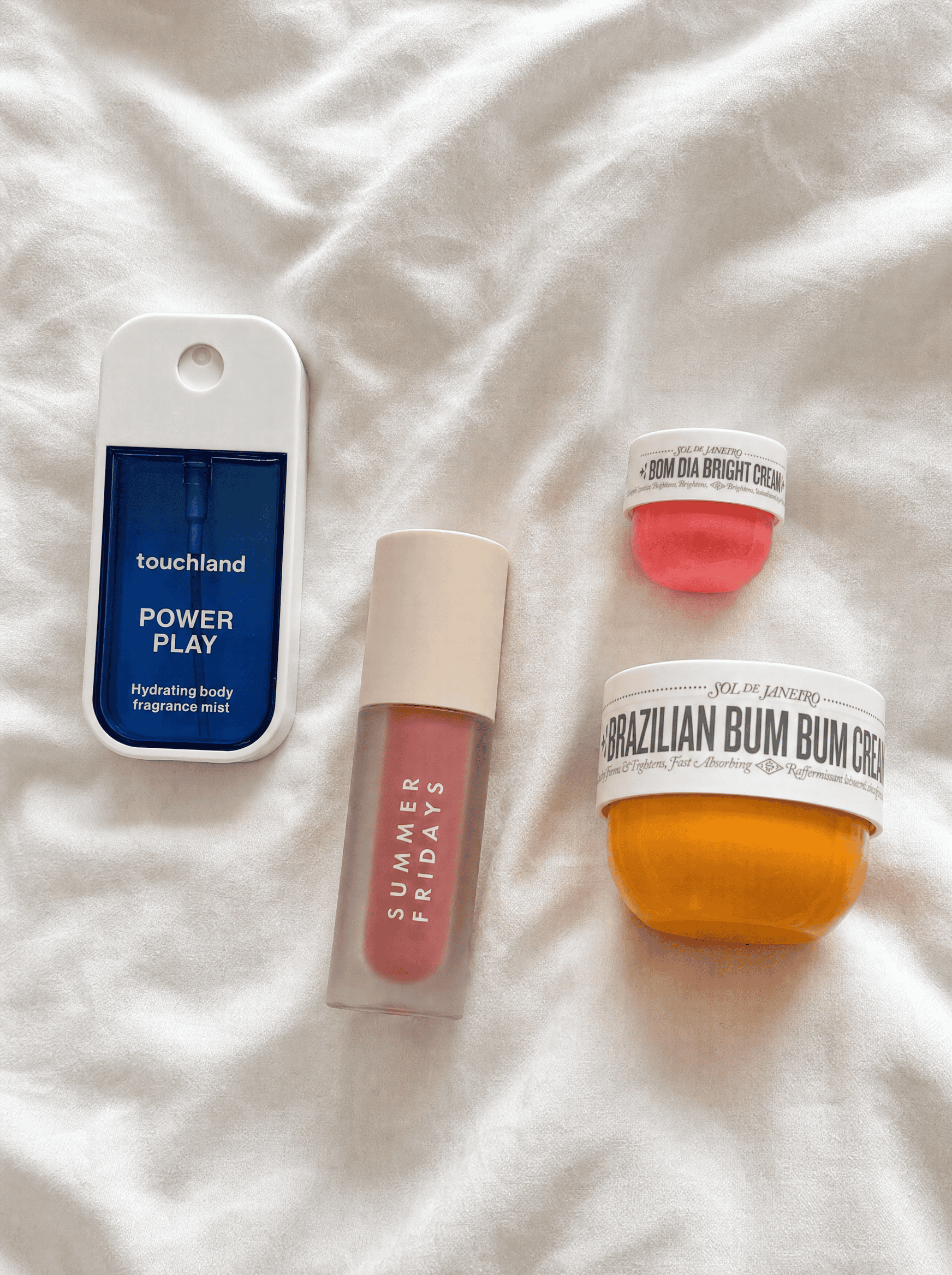 touchland , bum bum cream, and summer fridays laying flat on surface
